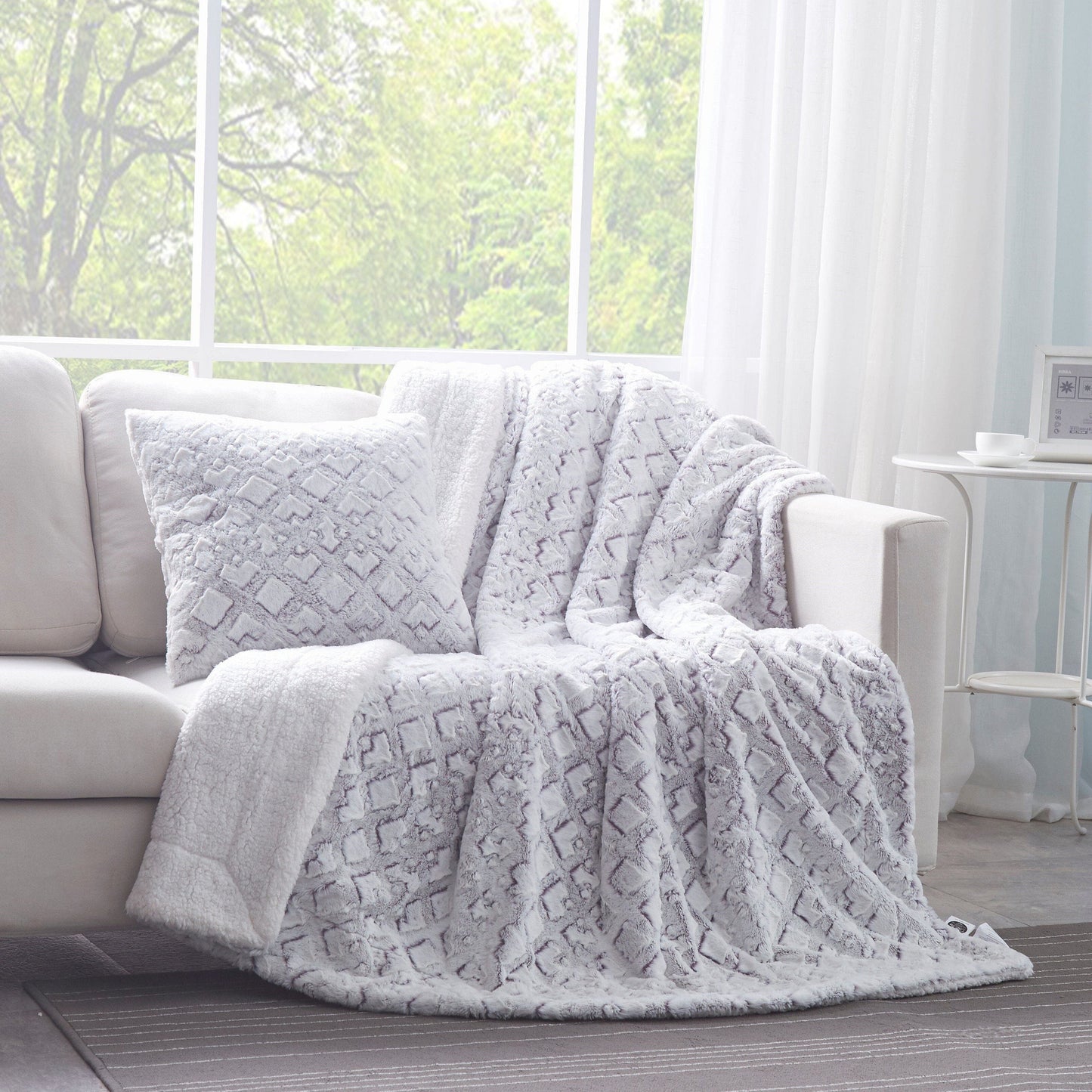 Dreamy Milky Way faux fur pillow cover styled on a cozy modern sofa