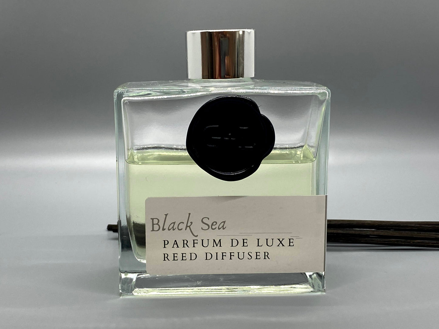 Black Sea Parfum de Luxe reed diffuser on a gray background