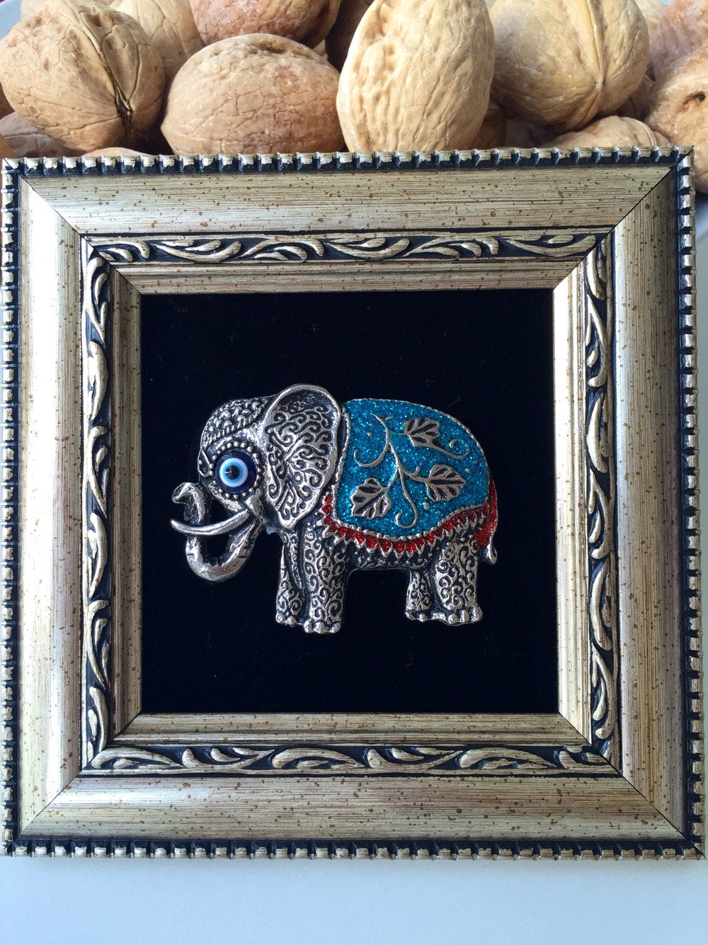 blue elephant evil eye framed wall decor close-up