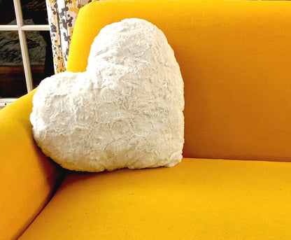 Heart pillow on sofa as cozy accent