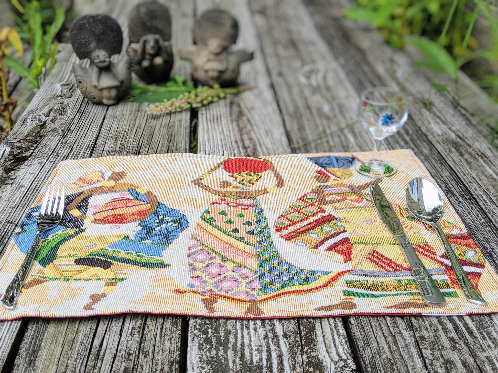 Flat lay of DaDa Bedding Kwanzaa Collection African Dreams placemats – tribal design for festive dining setting.