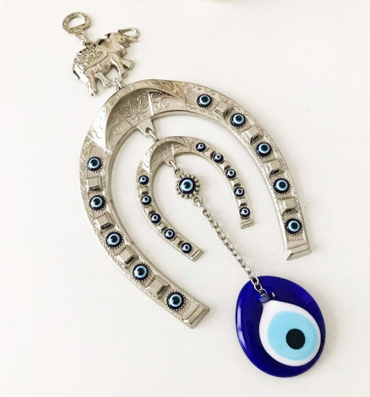 good luck metal horseshoe decor with glass evil eye