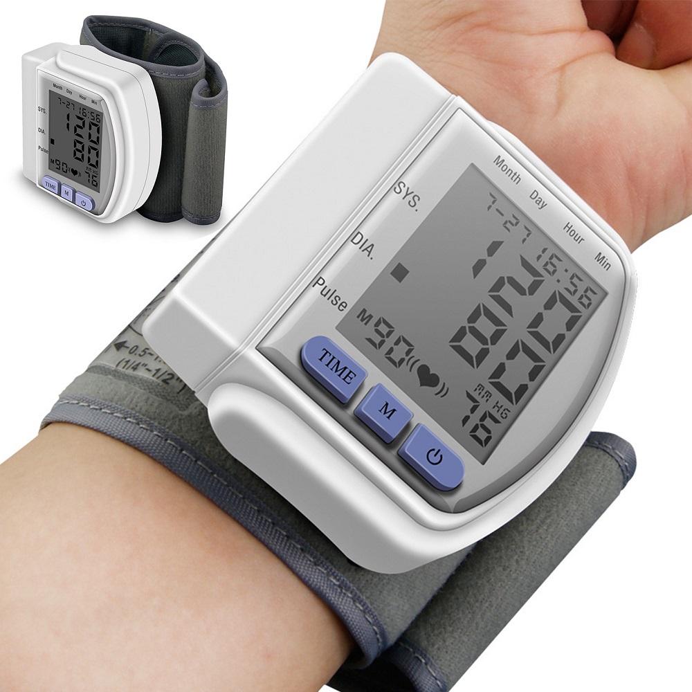 Digital wrist blood pressure monitor CK-102S with LCD screen display.