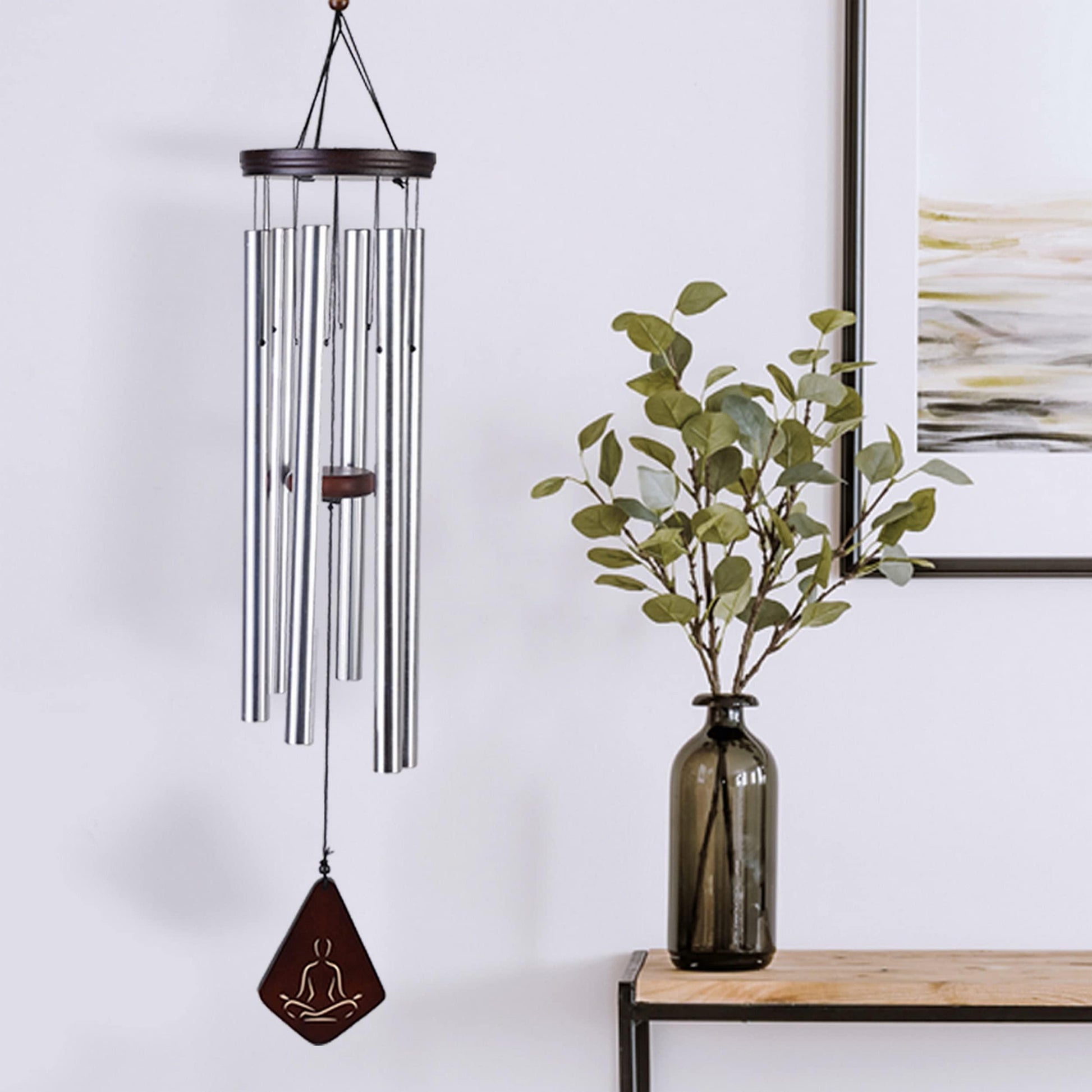 Wind chimes displayed indoor with natural lighting