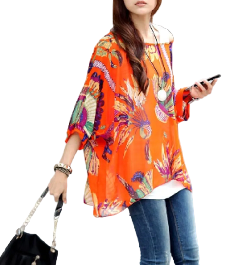 Woman in an orange floral kimono-style top crossing a street.