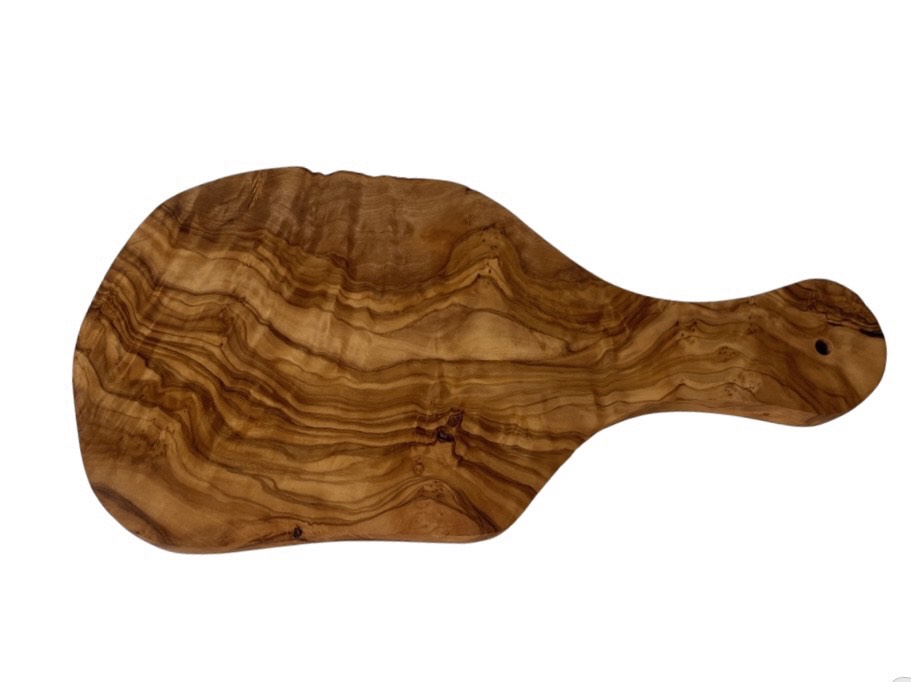 “Handcrafted olive wood cutting board with handle showcasing rich natural grain.”