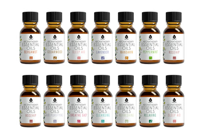 Collection of 16 bottles of essential oils on a white background