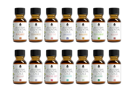 Collection of 16 bottles of essential oils on a white background