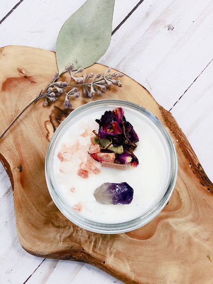 Krombee Remembrance Candle in a glass jar with dried flowers on a wooden surface