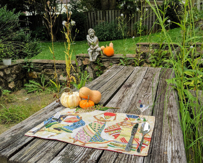 Single DaDa Bedding African Dreams placemat on neutral table – elegant Kwanzaa Collection woven tribal art piece.