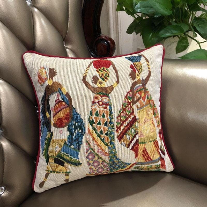DaDa Bedding Kwanzaa Collection African Dreams throw pillow covers on beige sofa – vibrant tribal African women design home décor accent.