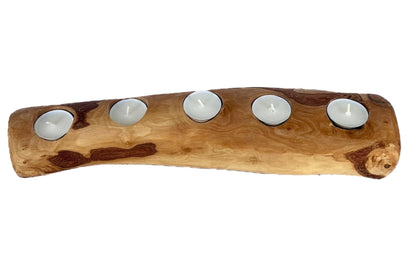 “Handcrafted olive wood candle holder displaying rich natural grain and warm tones.”