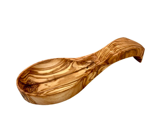 Handcrafted olive wood spoon rest showing natural grain patterns