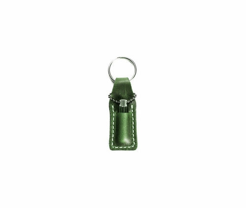 Krombee presents Green leather keychain with a silver clip on a white background