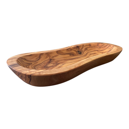 “Handcrafted olive wood wavy bowl showcasing natural grain patterns and Mediterranean elegance.”