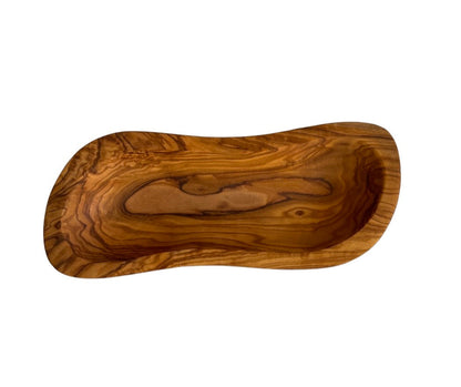 “Handcrafted olive wood wavy bowl showcasing natural grain patterns and Mediterranean elegance.”