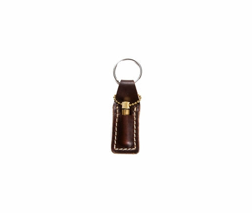 Krombee presents Brown leather keychain with gold accent on a white background