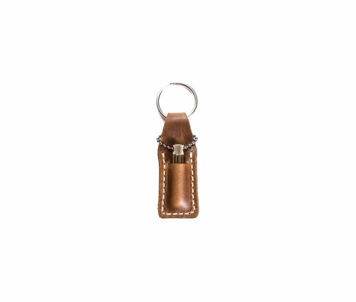 Krombee presents Brown leather keychain with a silver ring on a white background