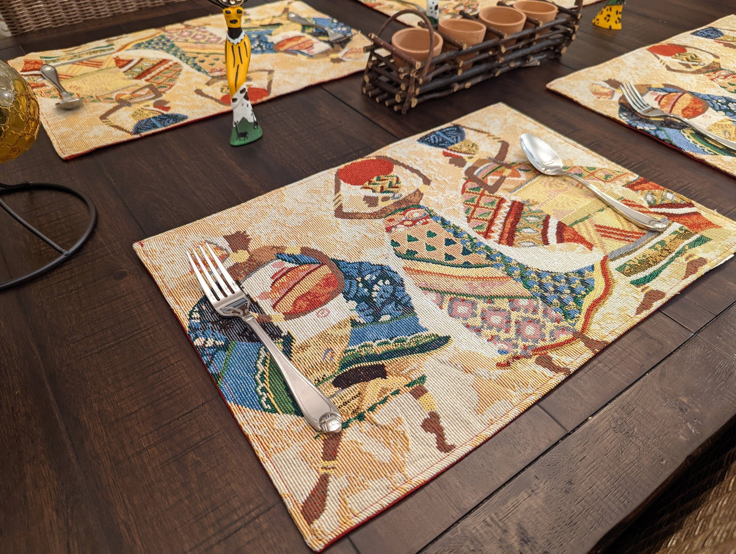 Close-up of DaDa Bedding African Dreams placemat – detailed woven cotton-linen texture with red and yellow tribal stitching.