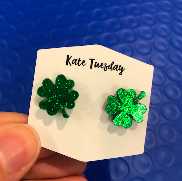 Glitter acrylic four-leaf clover earrings designed for St. Patrick’s Day