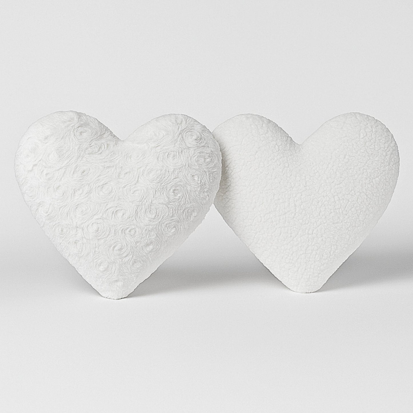 Close-up front and back texture faux fur white roses heart shaped pillow