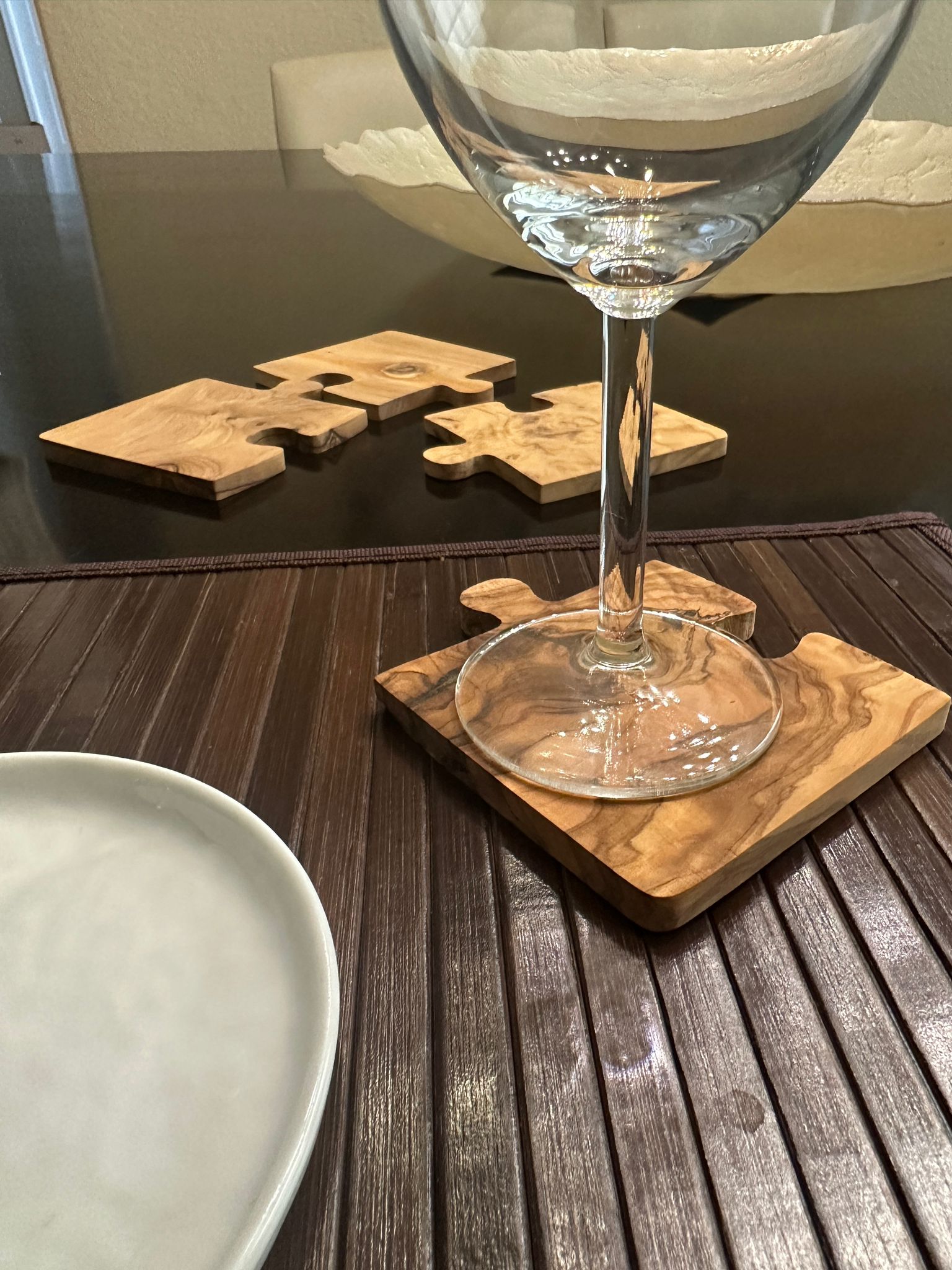 Coaster pieces separated to show puzzle design and craftsmanship