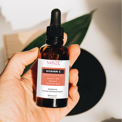 vitamin c serum bottle close-up in hand