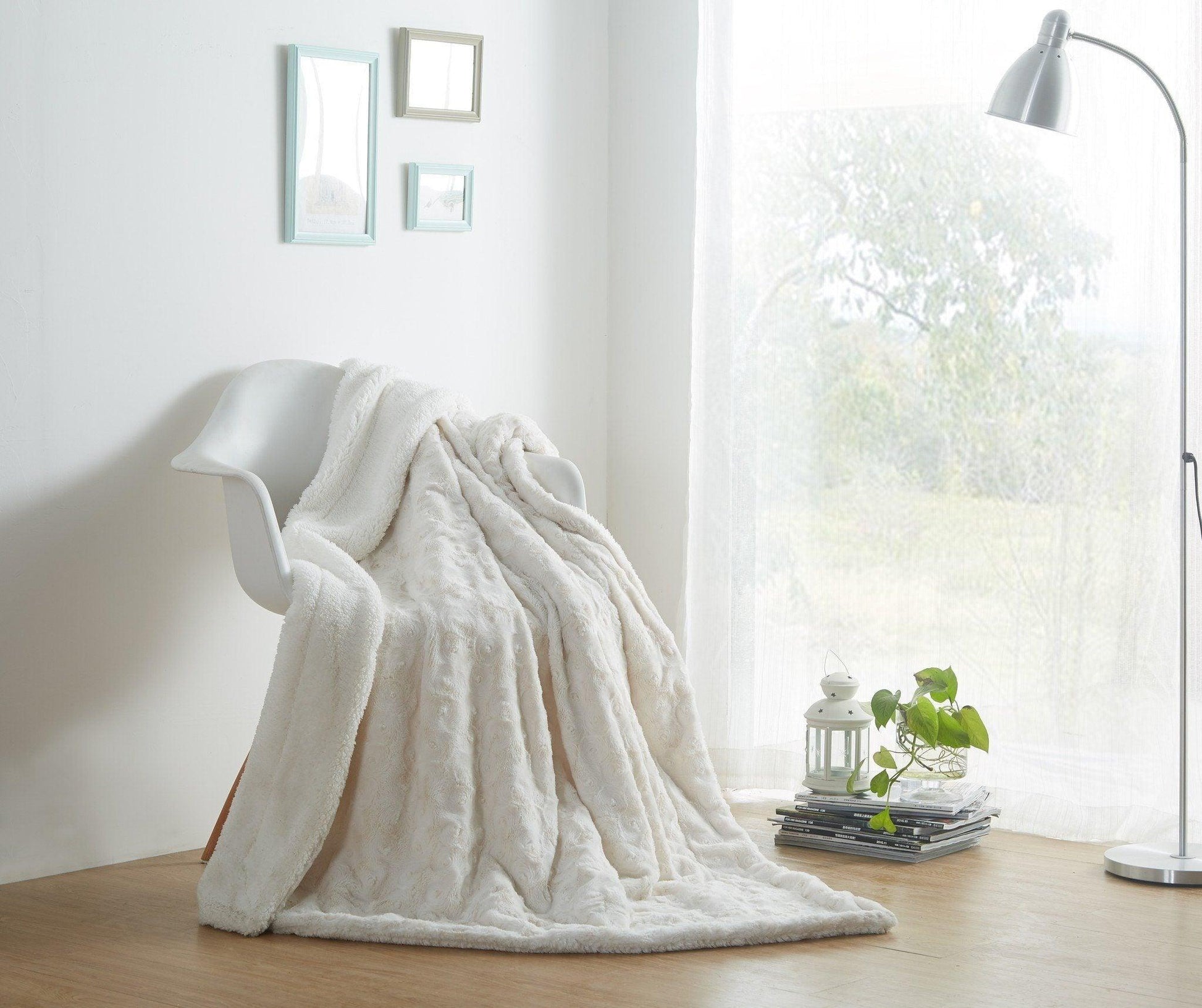 White roses faux fur sherpa throw blanket on a chair