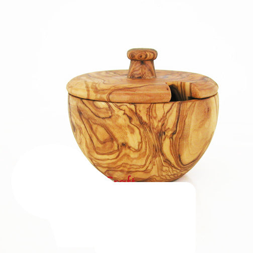 Hand-carved Mediterranean olive wood canister displaying natural grain patterns