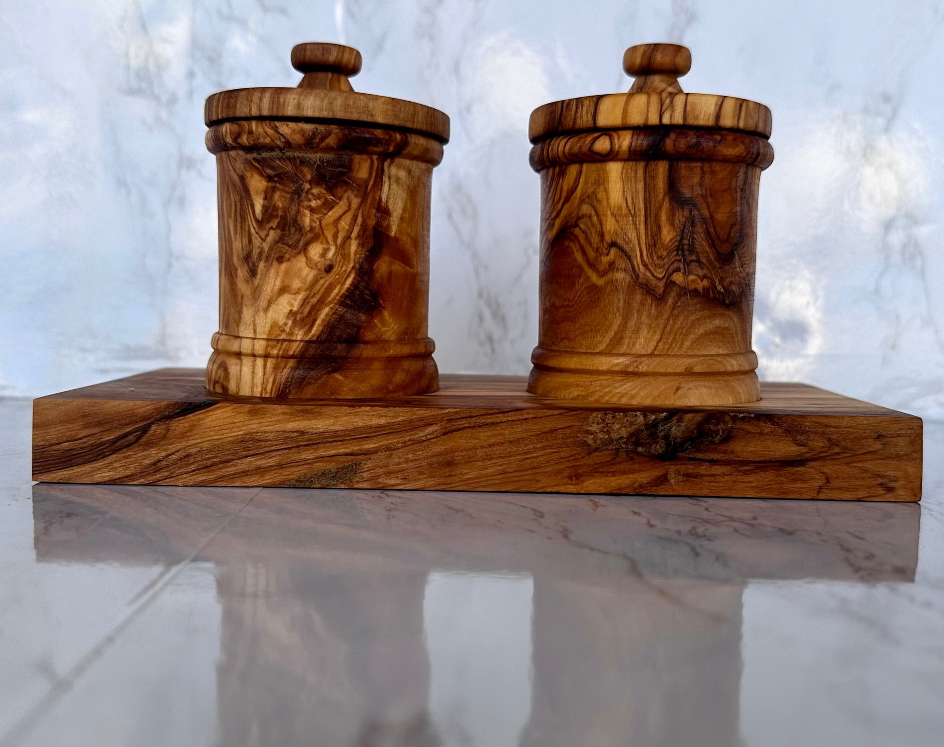 Close-up of handcrafted olive wood canisters showing the rich grain customers love for stylish kitchen décor