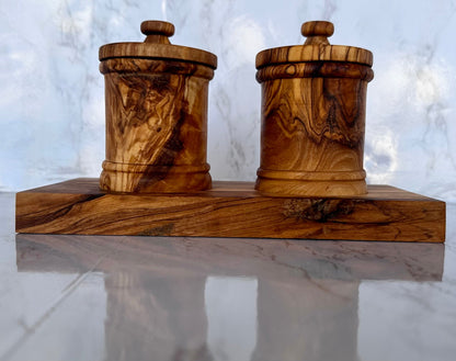 Close-up of handcrafted olive wood canisters showing the rich grain customers love for stylish kitchen décor