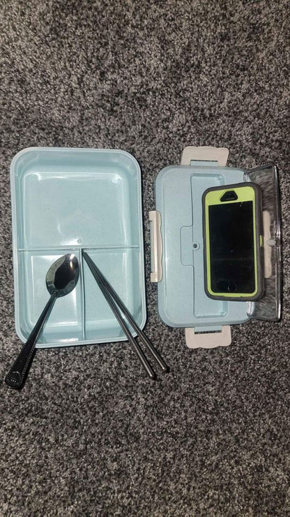 Microwave-safe bento lunch box with built-in phone stand and utensils