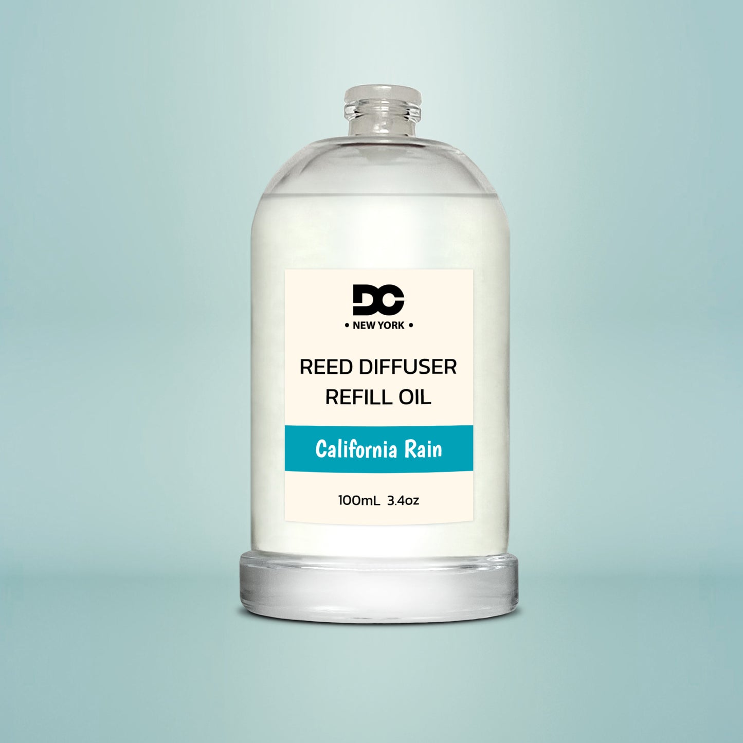 Reed diffuser refill oil bottle labeled 'California Rain' on a light blue background