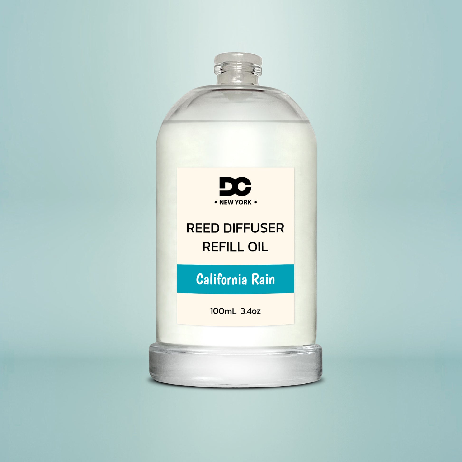Reed diffuser refill oil bottle labeled 'California Rain' on a light blue background