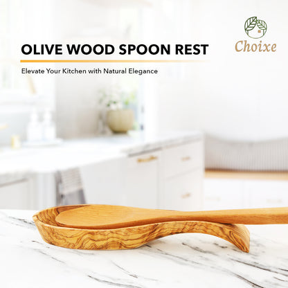 Olive wood spoon rest holding a cooking spoon on a kitchen counter