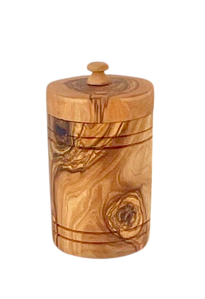 “Handcrafted olive wood spice jar with airtight lid, perfect for keeping salt fresh on the countertop.”