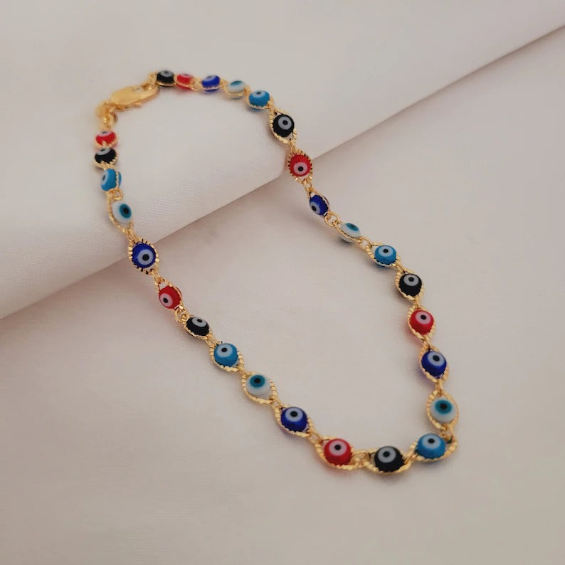 adjustable gold plated evil eye anklet on display