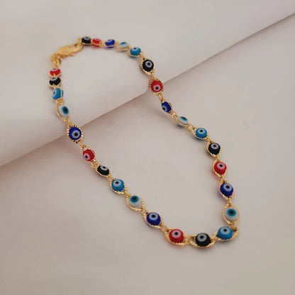 adjustable gold plated evil eye anklet on display