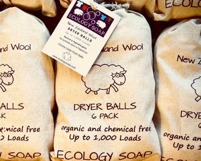 natural wool dryer balls in reusable storage bag