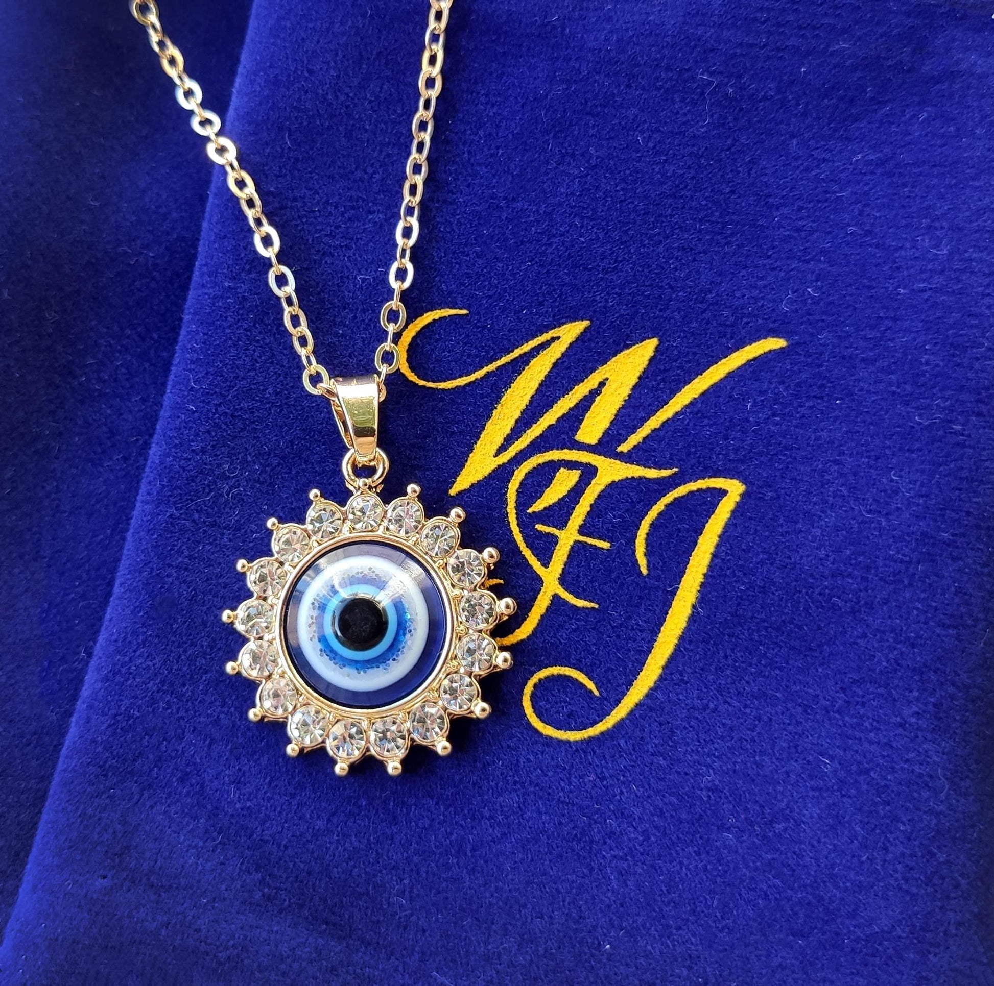 Blue jewelry pouch with evil eye necklace packaging