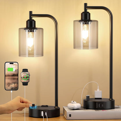 Modern black table lamp with glass shades, USB ports, and a smartphone charging station on a wooden surface.