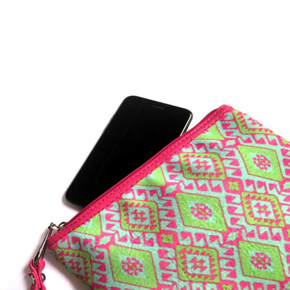 Amulet clutch with a phone inside on a white background