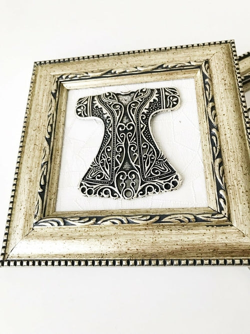 Caftan style symbolic framed wall hanging