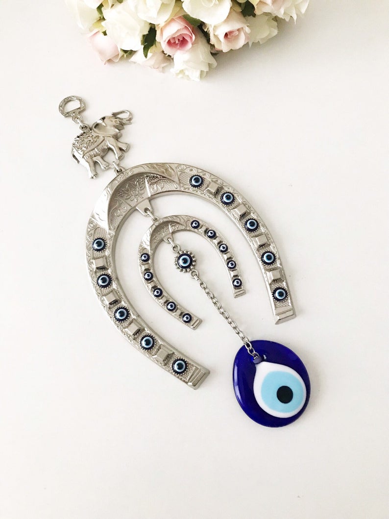 handmade horseshoe evil eye wall hanging