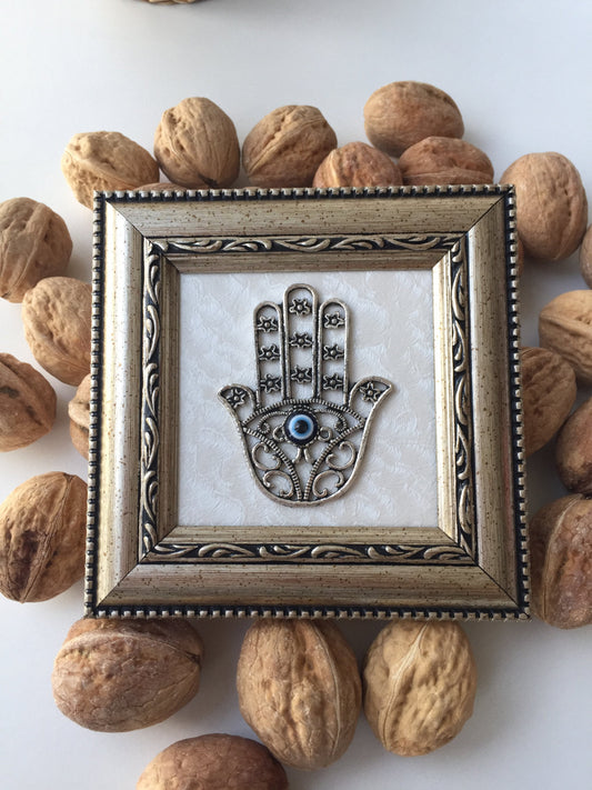 Handcrafted Hamsa and evil eye symbolic wall art