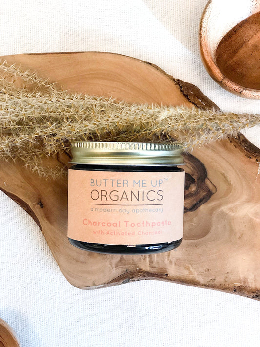 Organic activated charcoal toothpaste in 2oz glass jar with metal lid.
