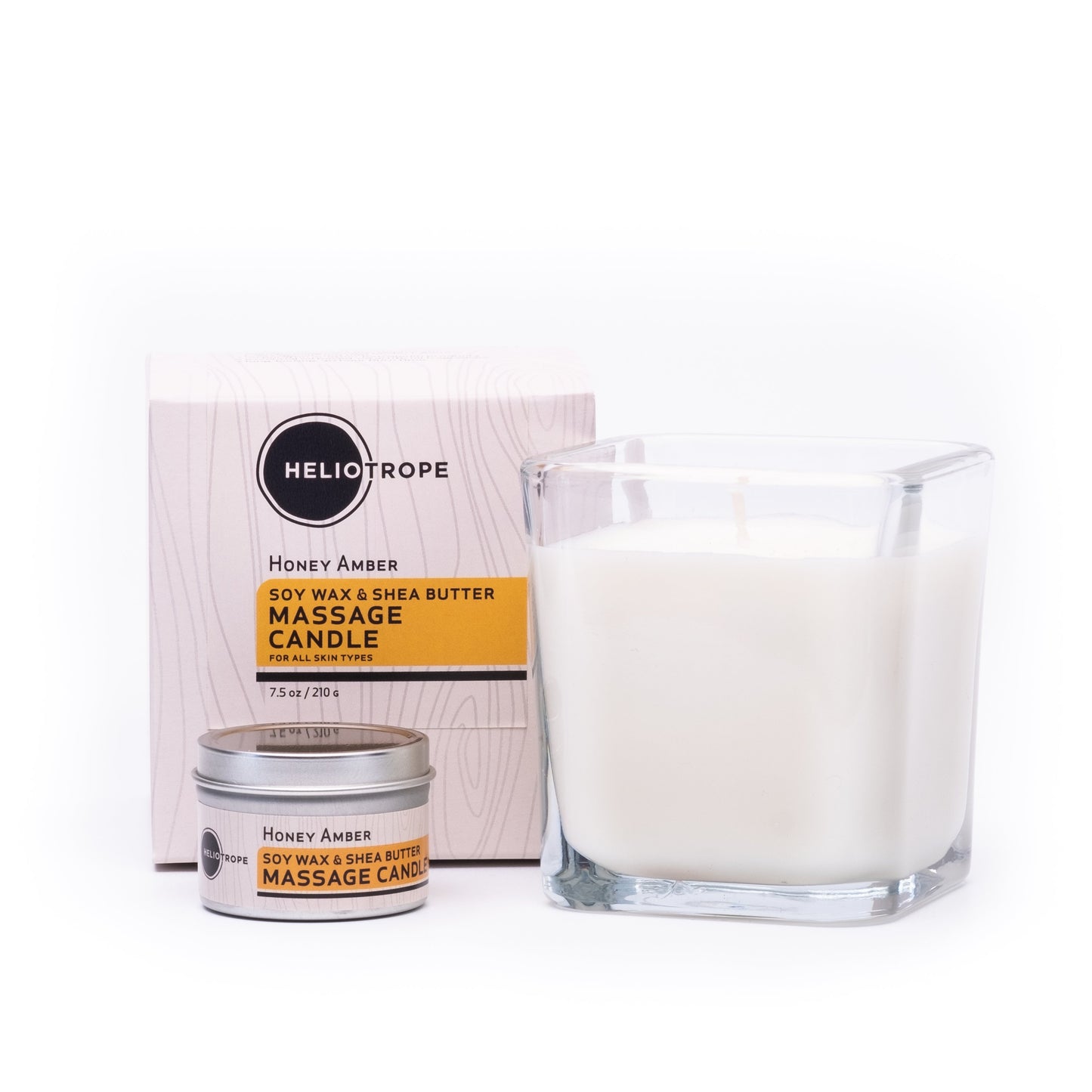 Heliotrope Honey Amber massage candle, jar, and tin on a white background