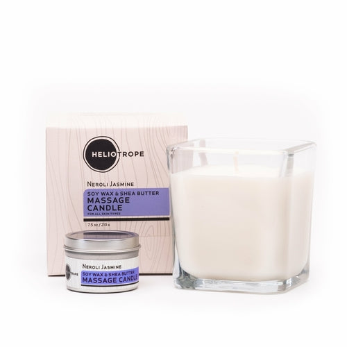 Massage candle and packaging with Heliotrope branding on a white background