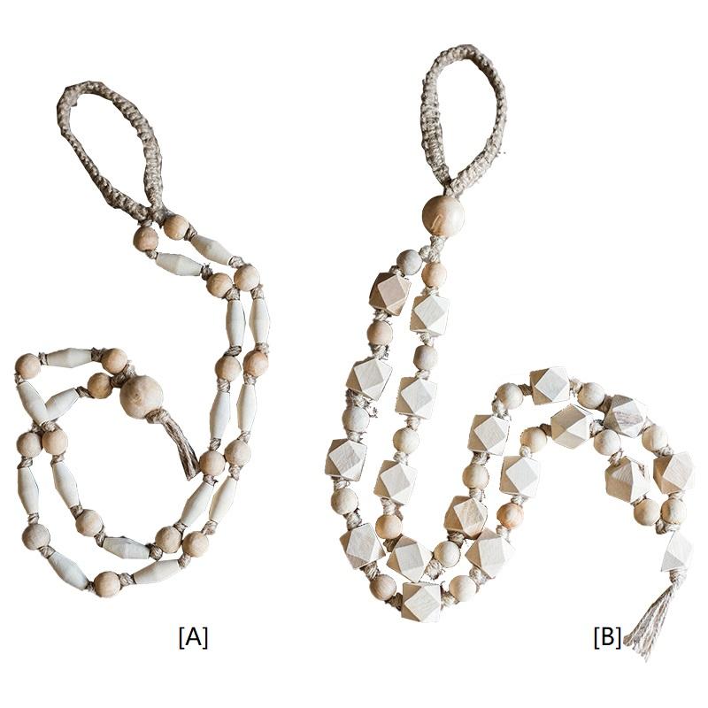 Two styles of wooden curtain tiebacks side by side